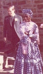 Herero fashions in 1969: Magdalena Bahuurua (housekeeper to Biship Mize) outside St George's Anglican cathedral in Windhoek (the priest in the picture is George Pierce). 