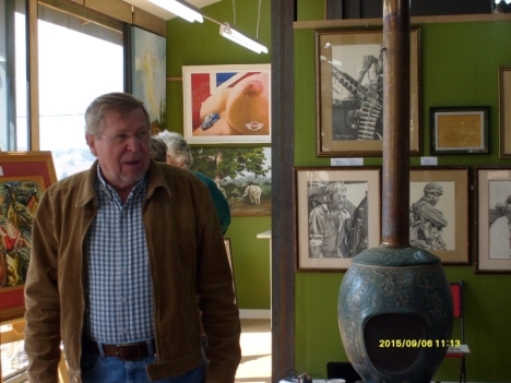 Peter Badcock Walters with the exhibition of his art in the Gallery on the Square, in Clarens.